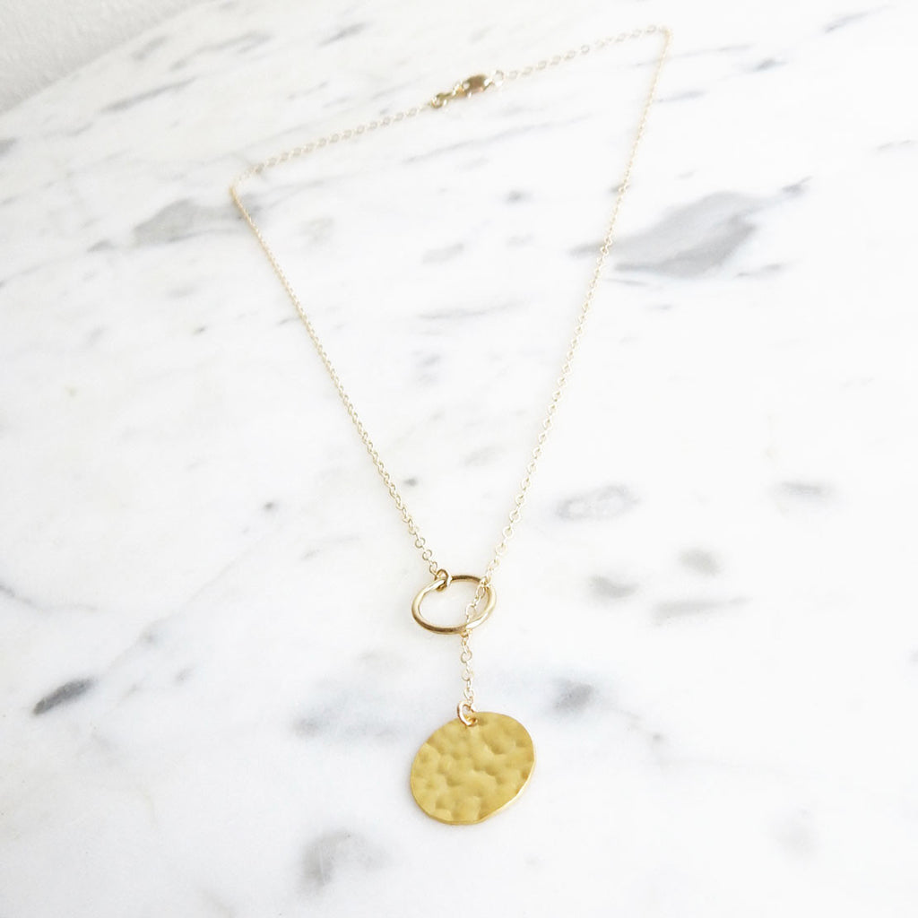 Serefina - gold filled lariat necklace with hammered disk - flatlay